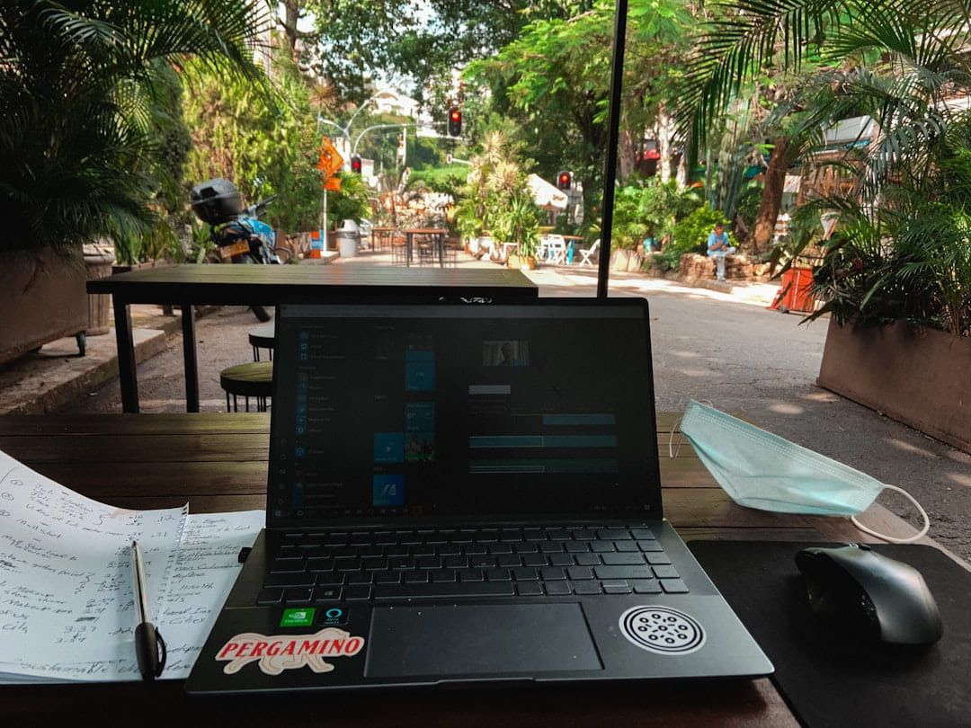 a laptop sits on a table on The Anywhere Office