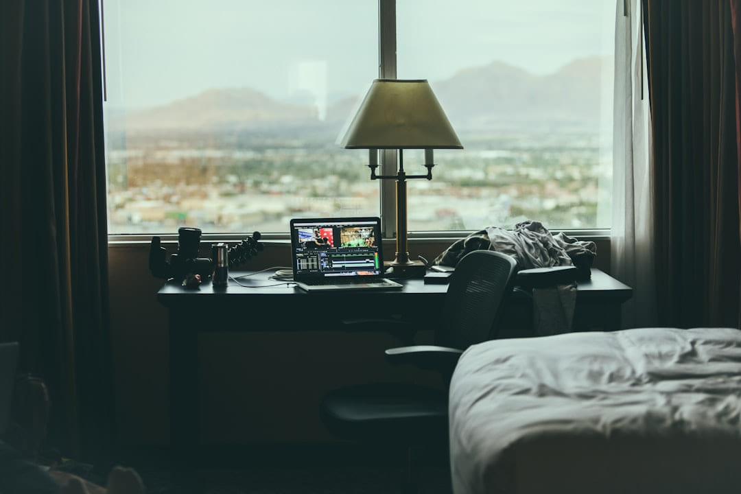 tabletop lamp beside laptop on desk beside window on The Anywhere Office