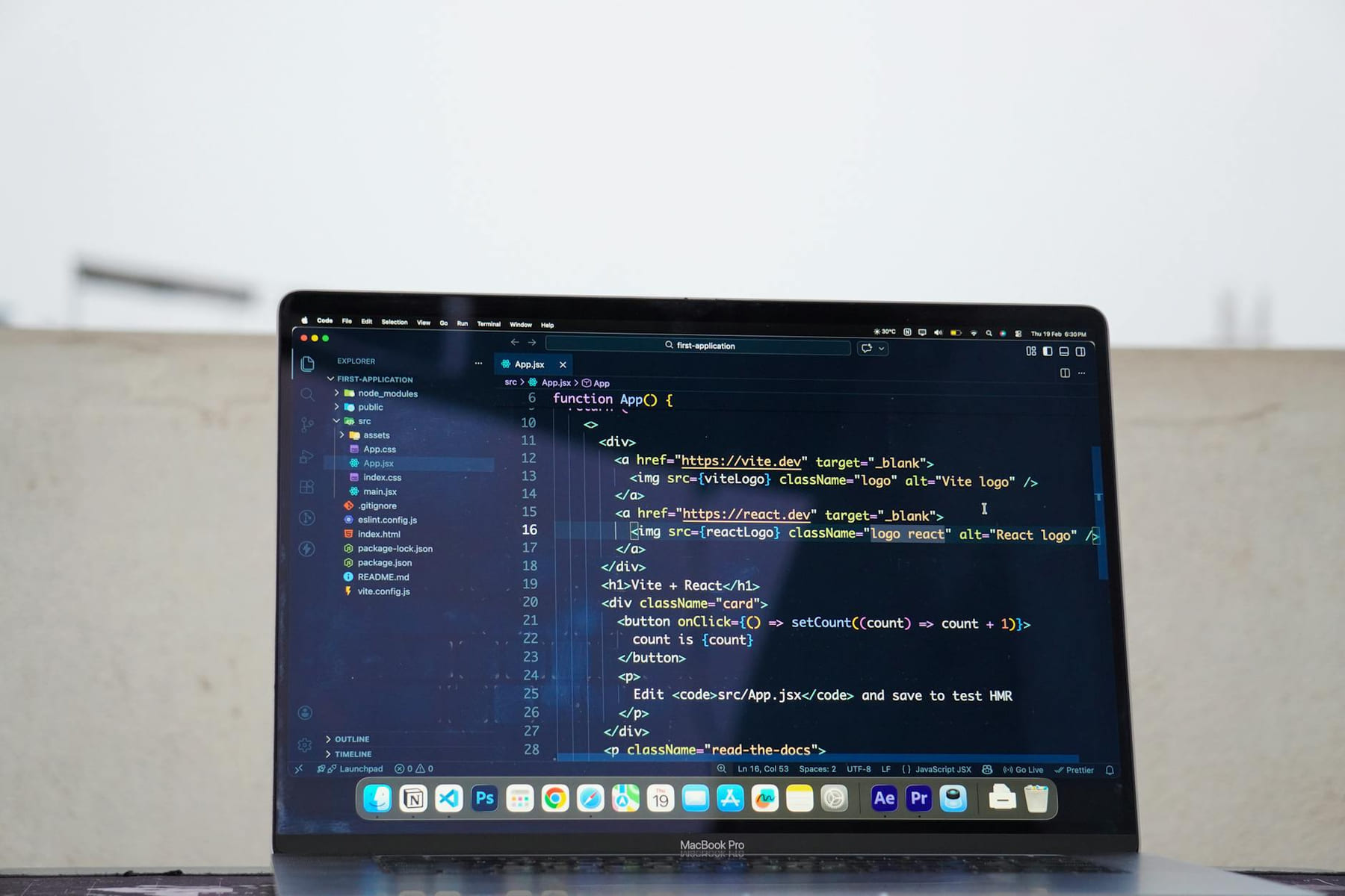 Laptop displaying code outdoors, ideal for remote work or freelance programming. on The Anywhere Office